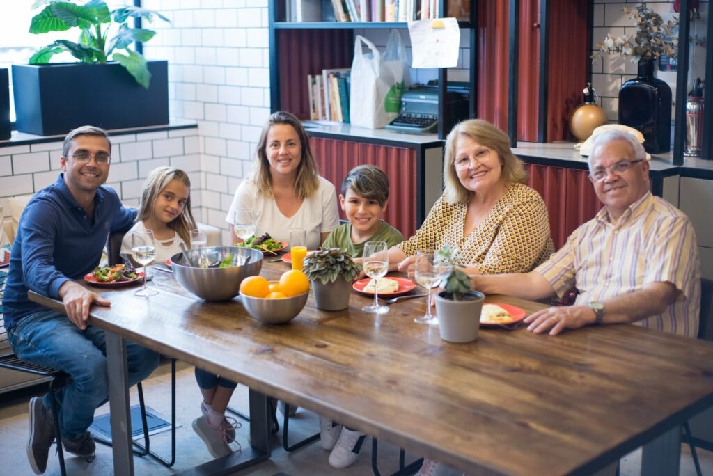 Multigenerational family sharing a meal around the table