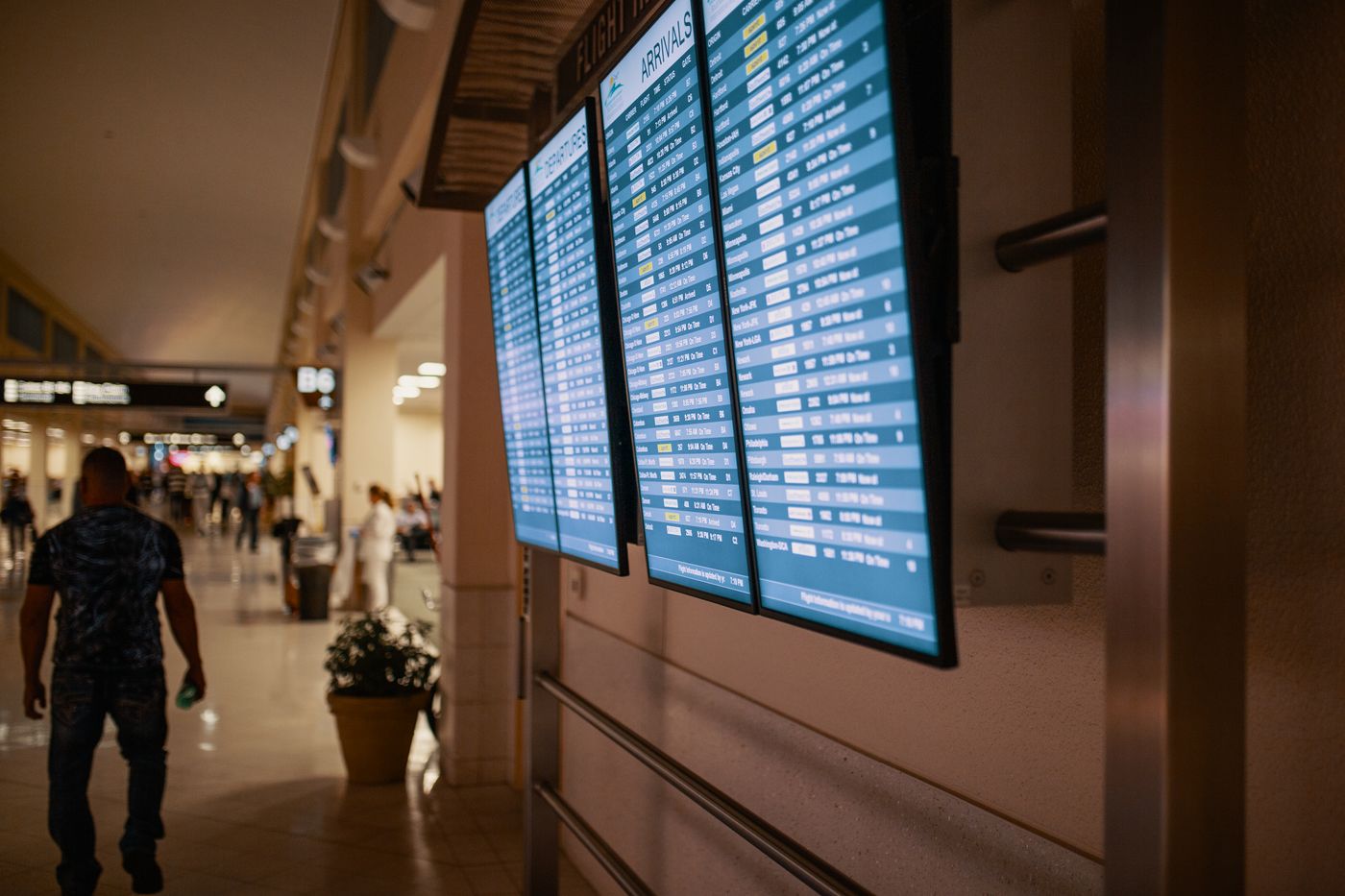 Airport terminal with flight information screens