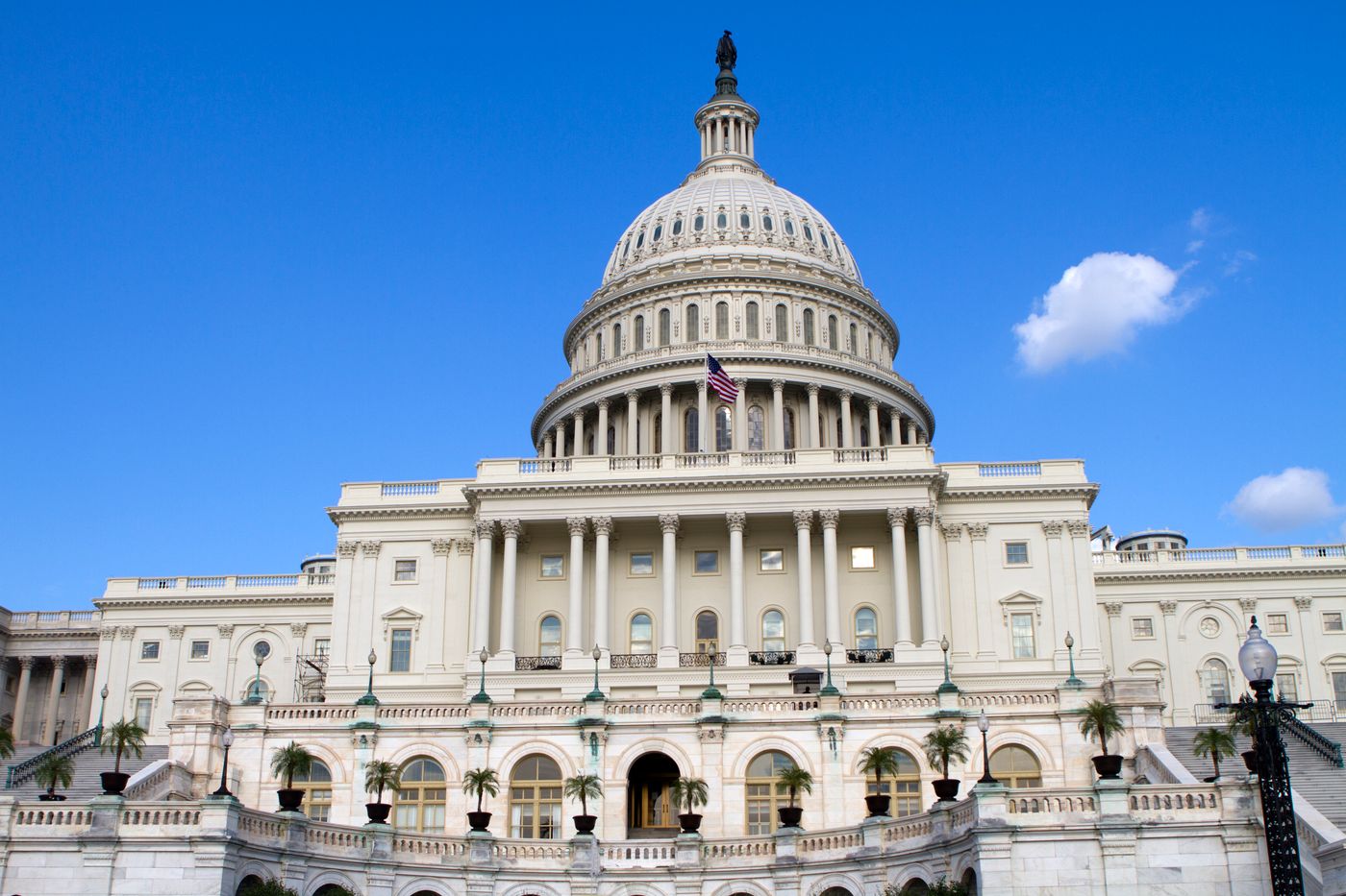 The U.S. Capitol under a bright blue sky