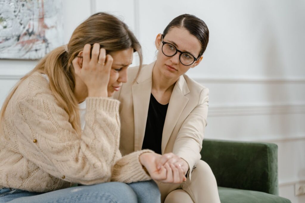 A woman comforting a friend who is going through a hard time